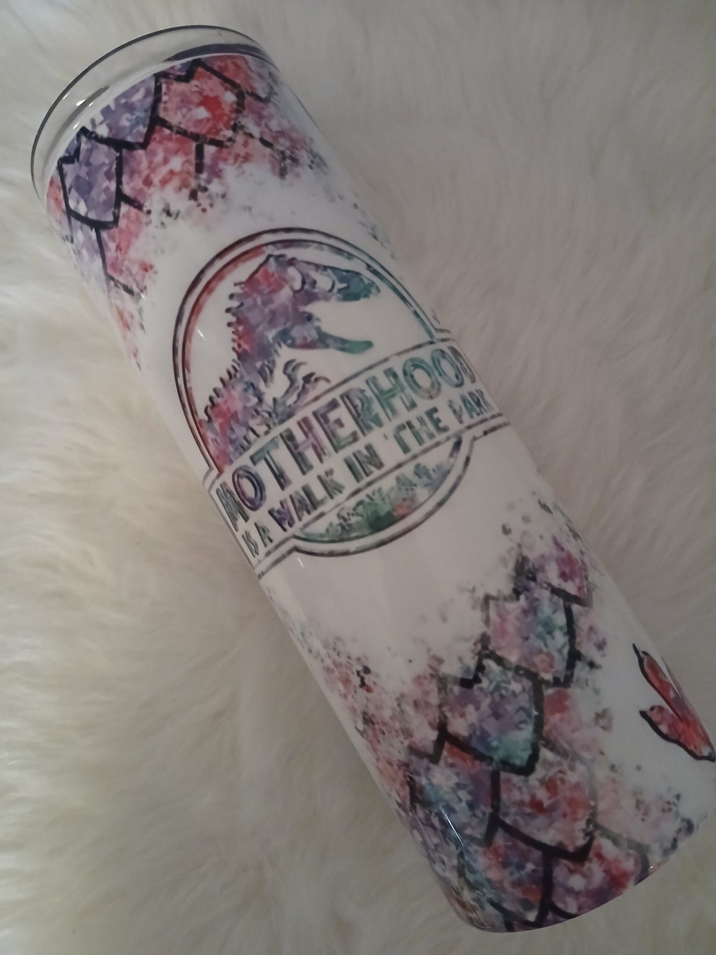 Motherhood a walk in the park 20 oz tumbler.